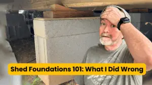 Kevin beside concrete blocks supporting a shed foundation